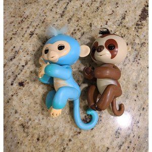 2  Fingerlings Interactive Baby Monkey Blue Brown Toys. Both work tested.